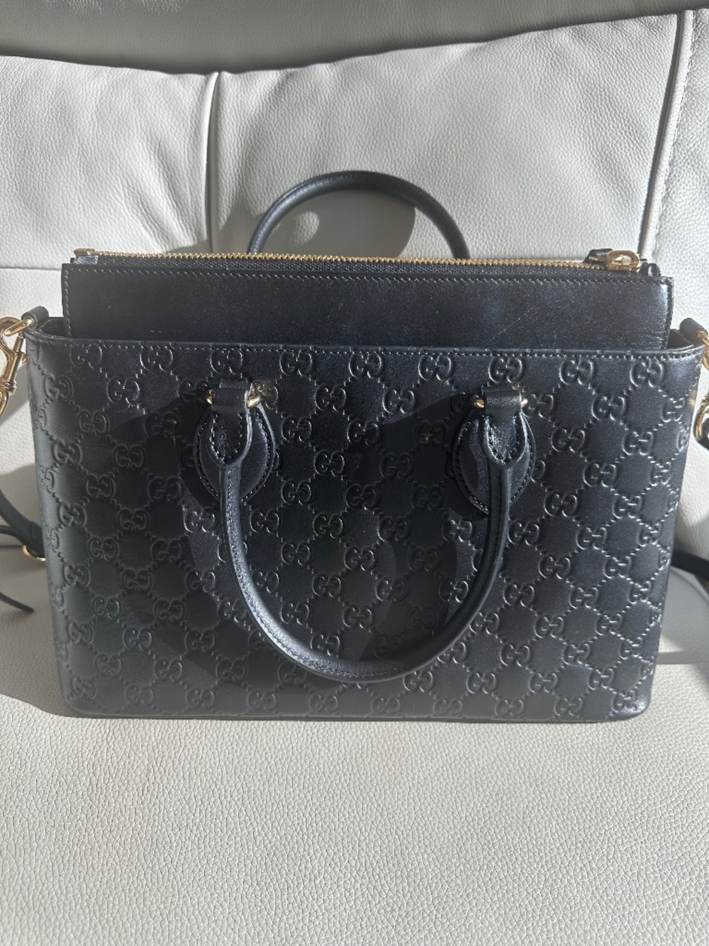 Authentic Gucci emblem embossed purse